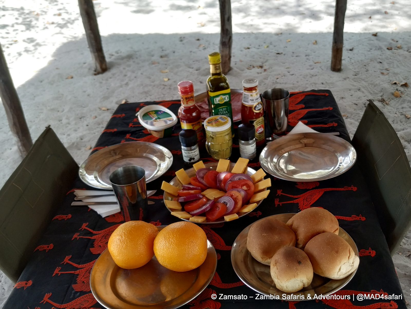 Lunch table set on a Zamsato camping safari