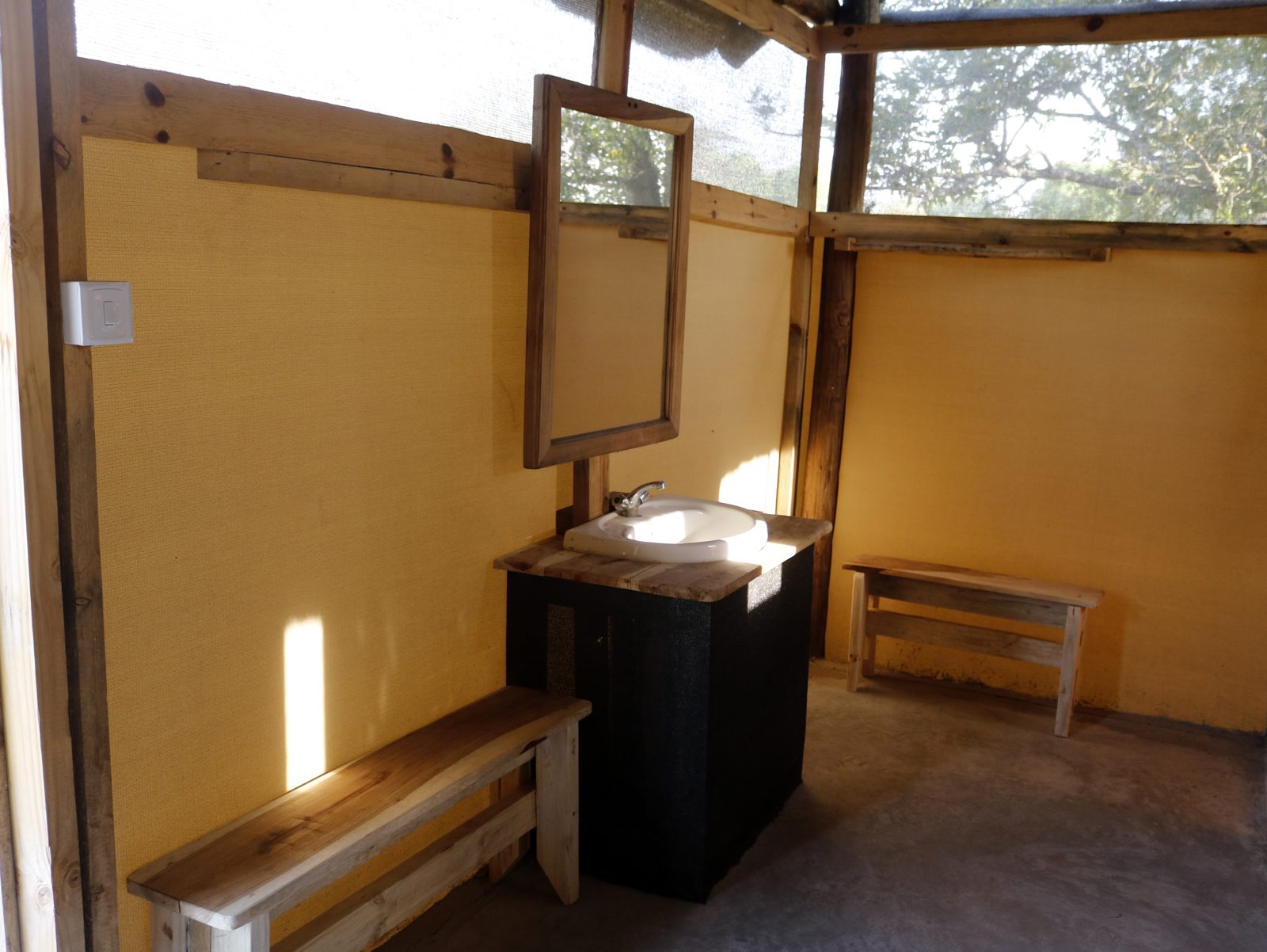 Wash basin and mirror inside the campsite ablutions